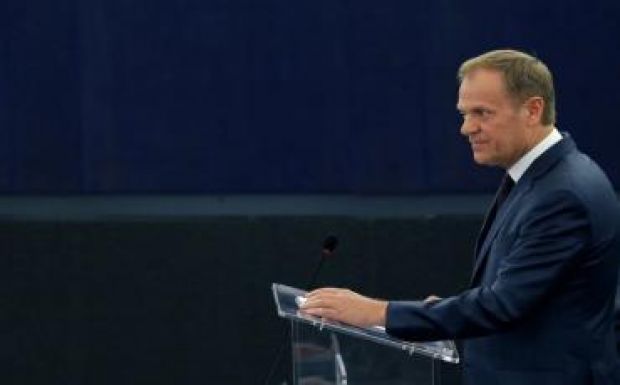 Tusk: nemzetközi összefogásra van szükség a menekültválság megoldására