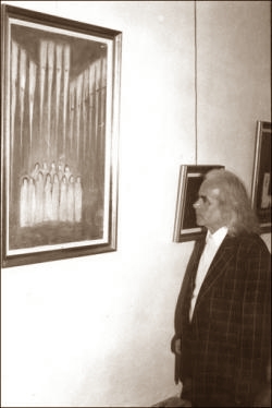 Györkös Mányi Albert a festménye előtt